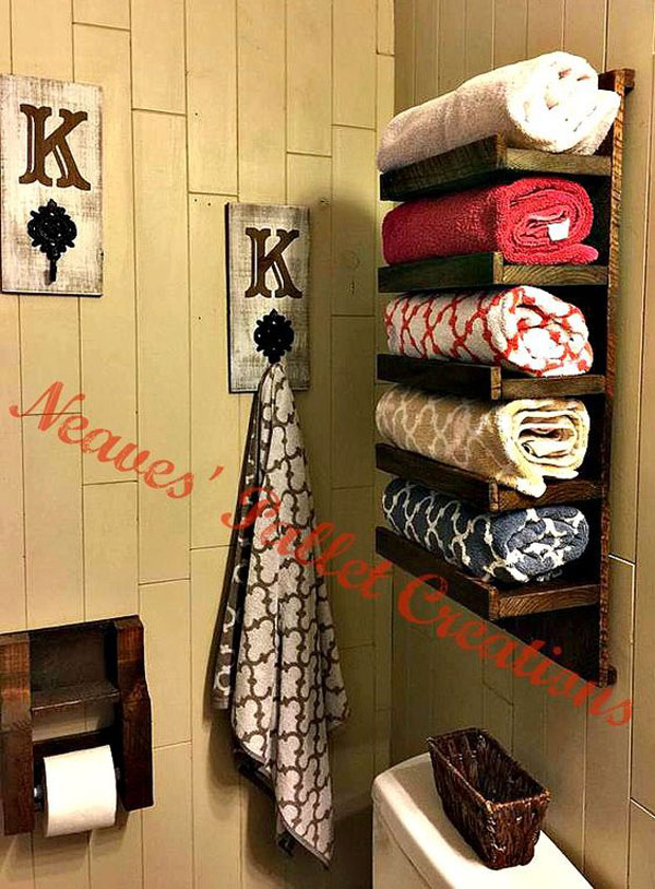 Re-purpose a piece of wooden pallet into towel rack