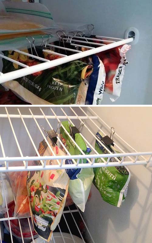 binder clips hanging from freezer shelves