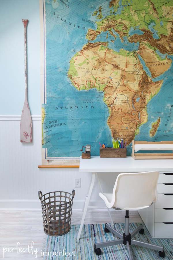 Simple white desk and shiny map